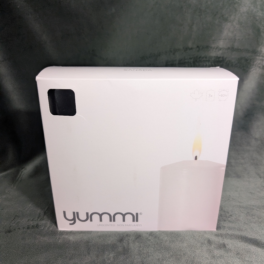 NWT Yummi 3x8 Black Pillar Candles 3 pack 80 hours. Clean Burning. MSRP $38
